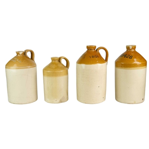 30 - Four Cornish stoneware flagons. Webb's Hotel Co Ld Liskeard, W & E.C.Carne Falmouth & Truro, Redruth... 