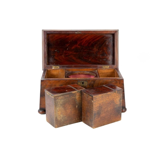 32 - An early Victorian sarcophagus shape tea caddy. Fitted with twin internal lidded compartments and a ... 