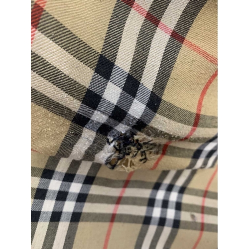 324 - Two Burberry trench coats. One black, one tan, both with a chest measurement of approximately 21