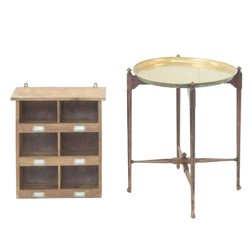 34 - An Eastern brass topped tray table. On a turned folding stand, height 71cm, diameter 57cm, together ... 