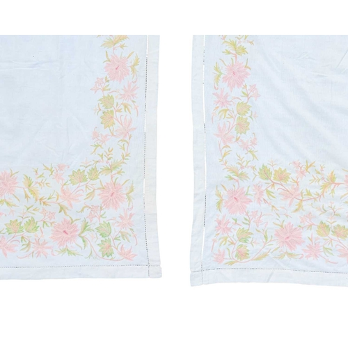347 - A pair of embroidered linen curtains. Cream with pink and green silk embroidered floral decoration, ... 