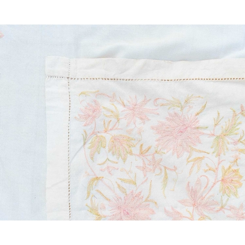 347 - A pair of embroidered linen curtains. Cream with pink and green silk embroidered floral decoration, ... 
