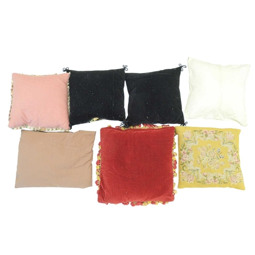 357 - A floral tapestry cushion with red and gold passementerie. 35cm x 35cm. Together with a pair of blac... 