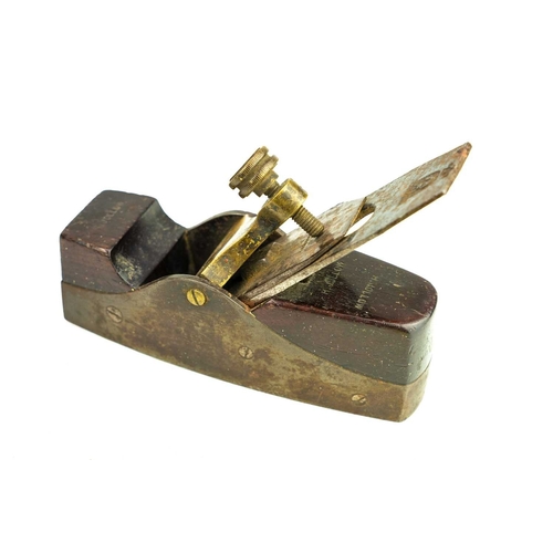 37 - A gun metal and steel smoothing plane. Coffin shape, with rosewood infil, fitted a Ward iron, length... 
