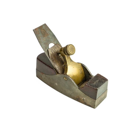 37 - A gun metal and steel smoothing plane. Coffin shape, with rosewood infil, fitted a Ward iron, length... 