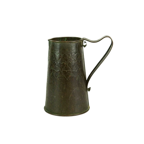 38 - An Arts and Crafts copper ale jug with repousse heart decoration. Height 21.5cm. Together with a J &... 