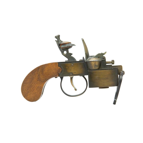 4 - A Dunhill 'Tinder Pistol' table lighter. Formed of wood and brass, the underside marked 'Made in Eng... 