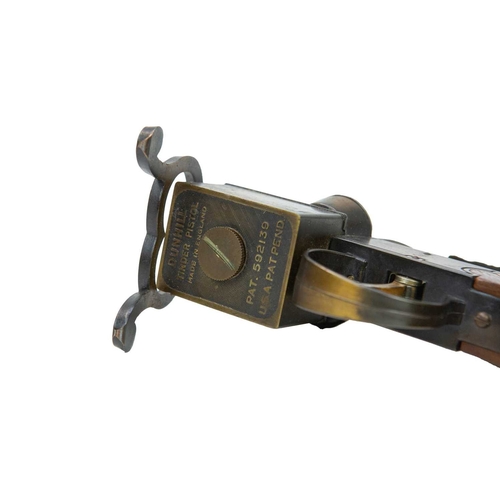 4 - A Dunhill 'Tinder Pistol' table lighter. Formed of wood and brass, the underside marked 'Made in Eng... 