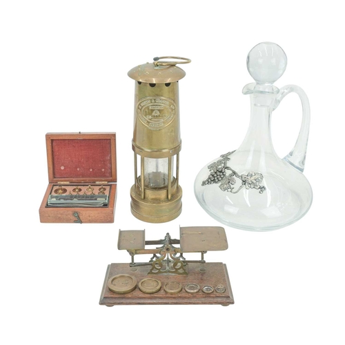 43 - A brass miner's lamp by E Thomas & Williams Ltd. Height 27cm, together with a set of Victorian oak a... 