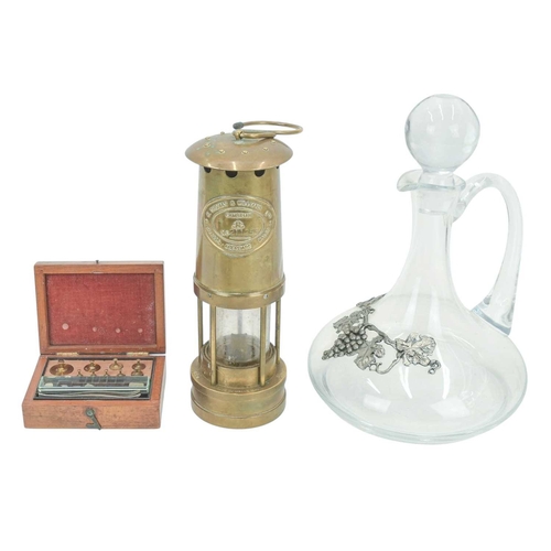 43 - A brass miner's lamp by E Thomas & Williams Ltd. Height 27cm, together with a set of Victorian oak a... 