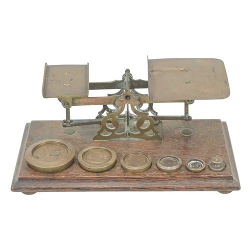 43 - A brass miner's lamp by E Thomas & Williams Ltd. Height 27cm, together with a set of Victorian oak a... 