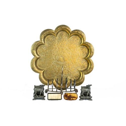 44 - A pair of Reed & Barton plated metal napkin rings. Late 19th century, cast with cherubs beside a lam... 