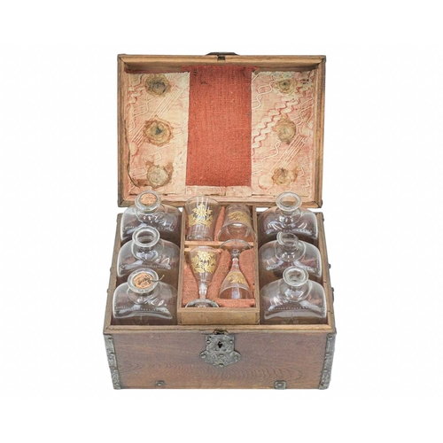 483 - A Dutch iron mounted oak ship's decanter box. 17th/early 18th century, the case with iron straps and... 