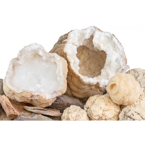 49 - A white quartz geode. Approximately 13cm diameter, another smaller, and several other similar smalle... 