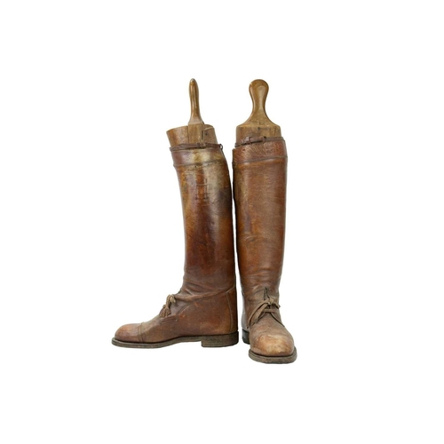 50 - A pair of brown leather military or riding boots. Early 20th century, approximate men's size 12 (UK)... 