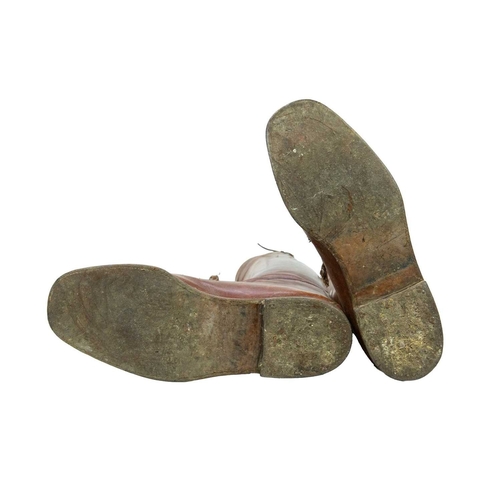 50 - A pair of brown leather military or riding boots. Early 20th century, approximate men's size 12 (UK)... 