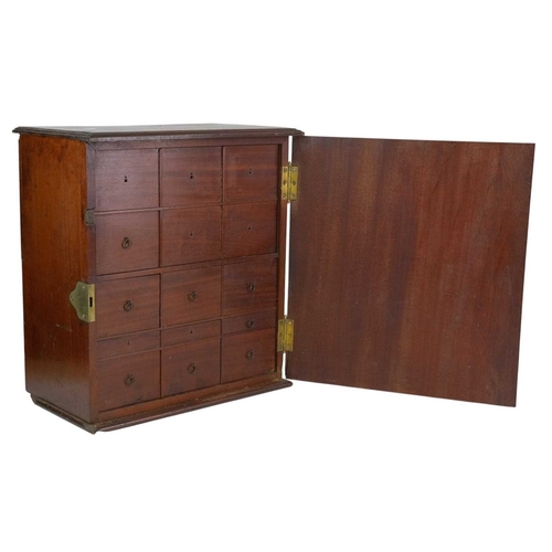 58 - A late George III mahogany apothecary cabinet. Fitted with a plain hinged door enclosing real and du... 