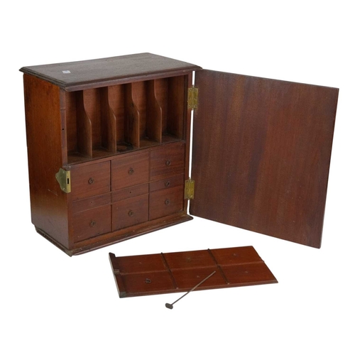 58 - A late George III mahogany apothecary cabinet. Fitted with a plain hinged door enclosing real and du... 