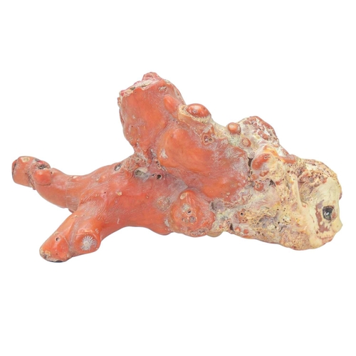 59 - A collection of coral. A beaded coral necklace, length 76cm, three coral snuff bottles carved as mon... 