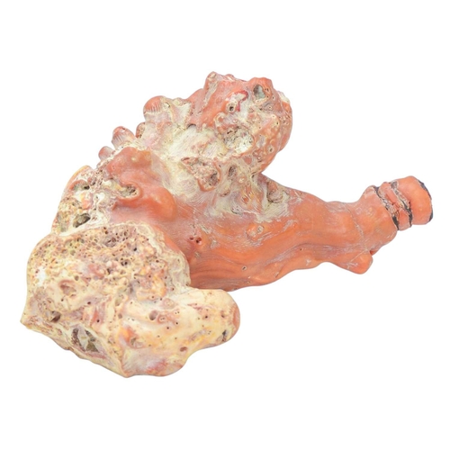 59 - A collection of coral. A beaded coral necklace, length 76cm, three coral snuff bottles carved as mon... 