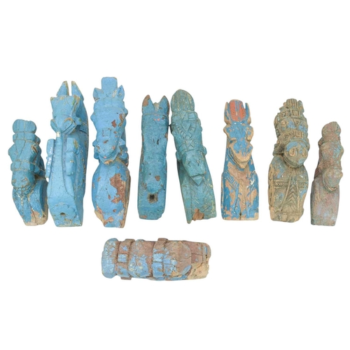 82 - A collection of Indian horse head carvings. Mostly with remnants of turquoise paint, various sizes a... 