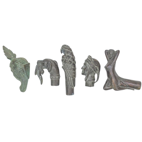83 - Four bronze walking cane handles. Each depicting figures, animals and birds, 13cm and smaller, with ... 