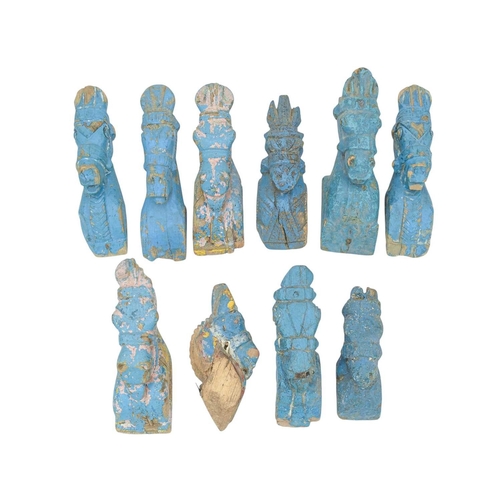 92 - A collection of Indian horse head carvings. Mostly with remnants of turquoise paint, various sizes a... 