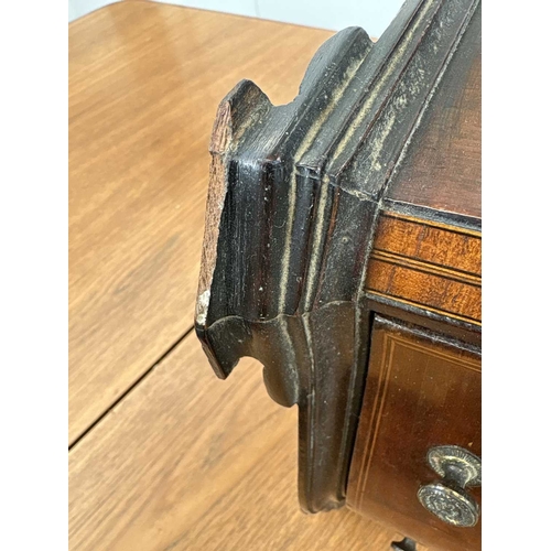 95 - A 19th century mahogany, inlaid and crossbanded serpentine front miniature chest. Fitted with four l... 