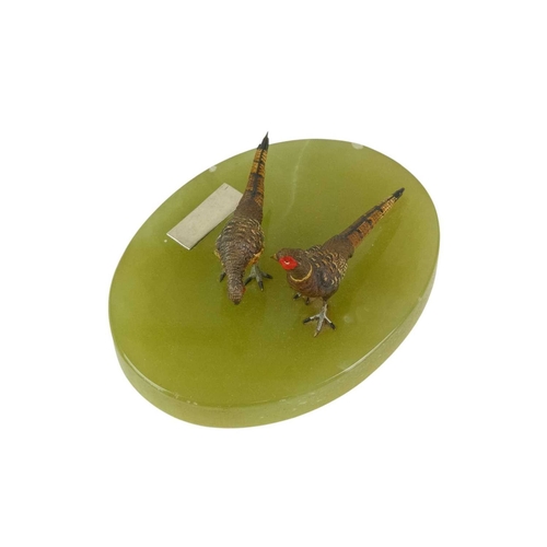 96 - A pair of Austrian cold painted bronze pheasants. Cast as a hen and a cock, on an oval onyx base, wi... 