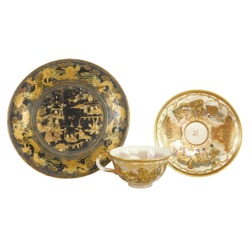 322 - A fine quality Japanese Satsuma small cup and saucer. Painted and gilt with figures in gardens, char... 