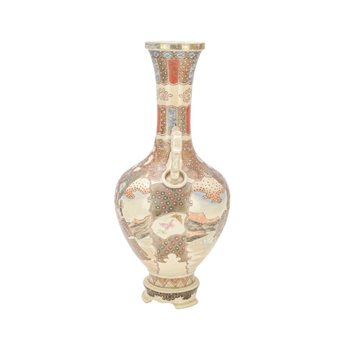 357 - A Japanese Satsuma pottery vase. Circa 1900, with dragon and ring moulded handles, painted with figu... 