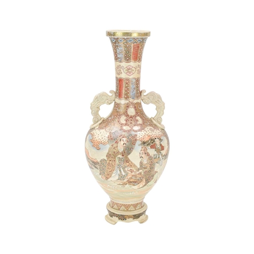 357 - A Japanese Satsuma pottery vase. Circa 1900, with dragon and ring moulded handles, painted with figu... 