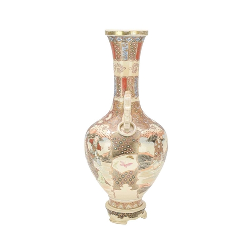 357 - A Japanese Satsuma pottery vase. Circa 1900, with dragon and ring moulded handles, painted with figu... 