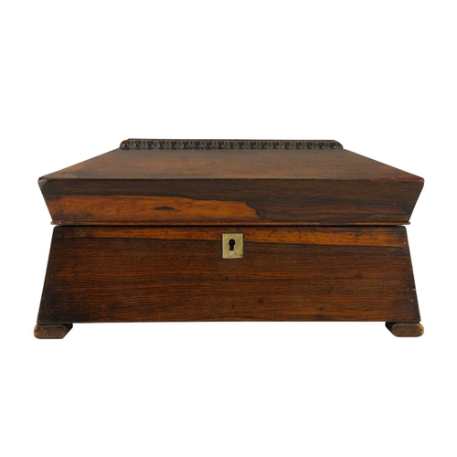 182 - A partridge wood tea caddy of sarcophagus form. 19th century, the hinged lid revealing a twin compar... 