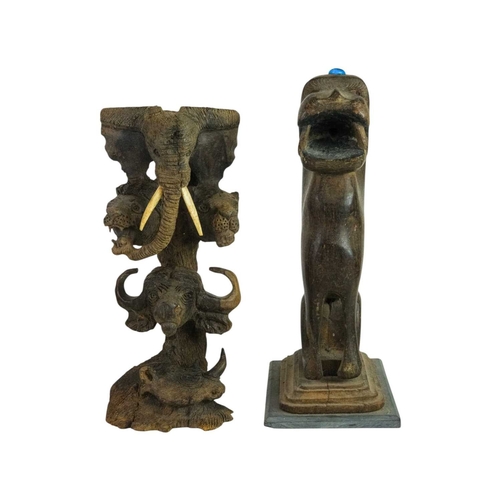 183 - An Indian carved hardwood figure of a lion or a tiger. Late 19th century, seated on its haunches, wi... 