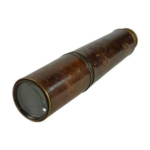 191 - A brass WWI era three draw brass telescope. With leather covered outer tube and lens covers, initial... 