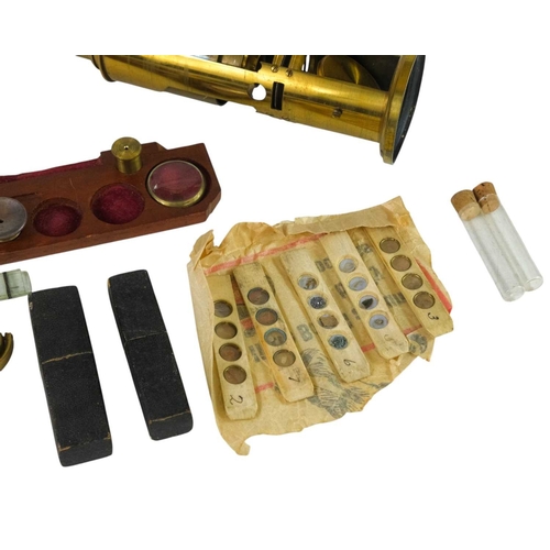 194 - A lacquered brass compound monocular drum microscope, 19th century, with rack and pinion focusing, n... 