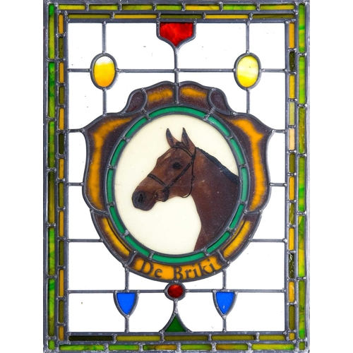 205 - A leaded and stained glass rectangular panel. 20th century, the central oval painted with a horse's ... 