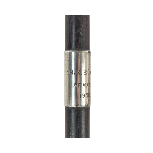 209 - An ebony long swagger stick. Banded in hallmarked silver, with rubbed markings, inscribed 'H.K. Boyl... 