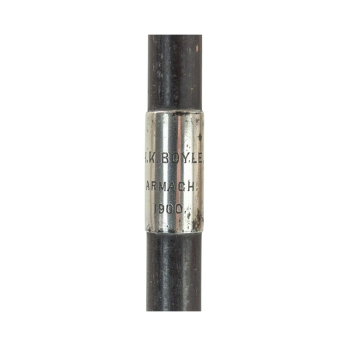 209 - An ebony long swagger stick. Banded in hallmarked silver, with rubbed markings, inscribed 'H.K. Boyl... 