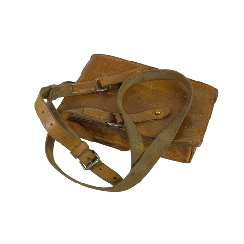 216 - A military leather four pouch magazine holder. With leather strap