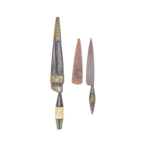 218 - A 19th century North African dagger. With a brass and bone hilt and single edge steel blade, leather... 