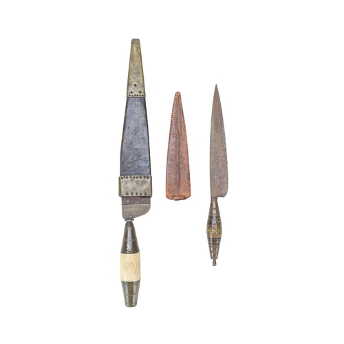 218 - A 19th century North African dagger. With a brass and bone hilt and single edge steel blade, leather... 