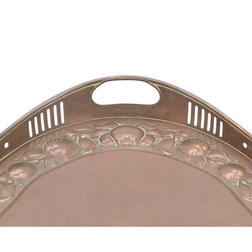 220 - A Newlyn oval galleried copper tray. With twin handles and pierced sides, with a broad border of med... 
