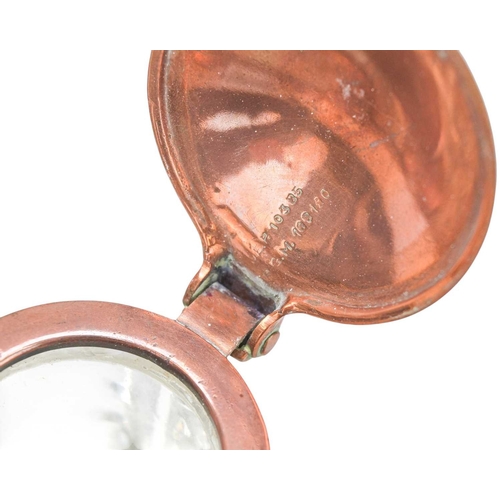 222 - An Art Nouveau copper inkstand. Glass inkwell with tulip shaped lid, the tray with cut-out decoratio... 