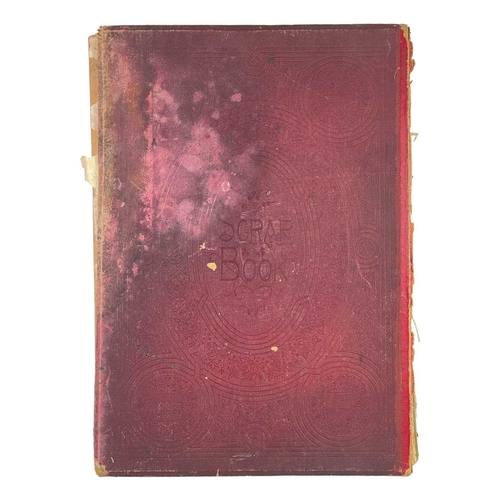 227 - A Victorian scrapbook. Three quarters full with lithographic printed scraps and postacrds, including... 