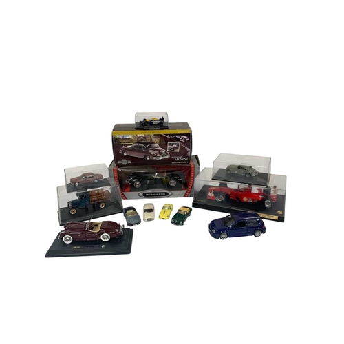 231 - Diecast Vehicles Including Various 1:18 Scale Models. Box containing various boxed and loose diecast... 