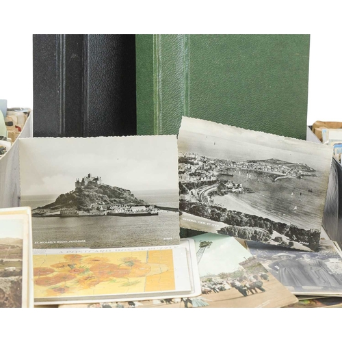 249 - 600 plus miscellaneous postcards. Lot comprises of two shoe boxes and two albums of cards, many sort... 