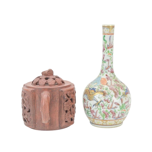 318 - A Chinese Yixing teapot and cover. With reticulated prunus decoration, impressed seal mark, height 1... 