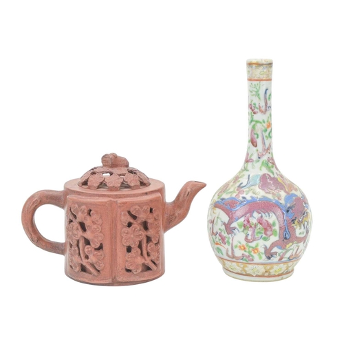 318 - A Chinese Yixing teapot and cover. With reticulated prunus decoration, impressed seal mark, height 1... 